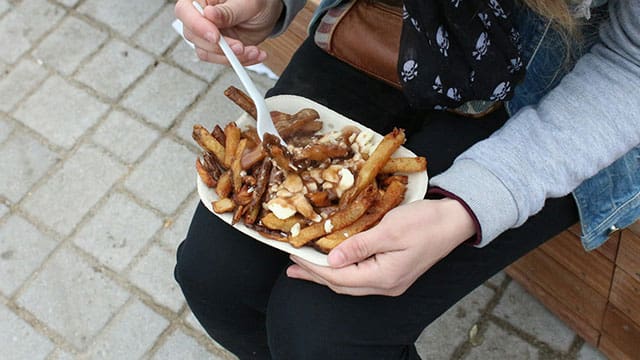 Poutine a Canadian icon celebrating 60 years of global delight